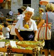 [ IMAGE: Greengrocer from Konavle at the
Dubrovnik market ]